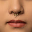 A close-up of a woman's face, focusing on her nose and lips, with a gold nose ring and red lips.