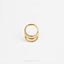 A gold ring with three concentric circles is shown against a white background.